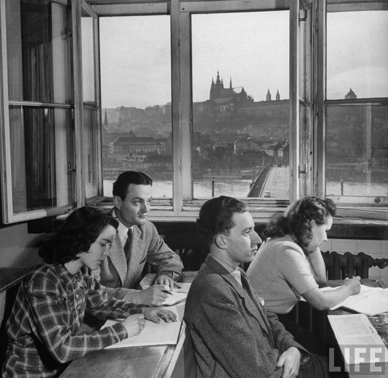 John Skrivanek (Rear L) of Austin,Texas, with fellow students in classroom of philosophy building of Charles University on banks of the Vltava River overlooking ancient Hradcany castle and St. Vitus Cathedral.