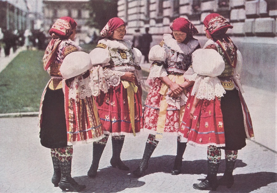 YOUNG WIVES OF SARDICE COME TO TOWN IN EMBROIDERED STOCKINGS, PIERCED BOOTS, AND STUFFED SLEEVES.