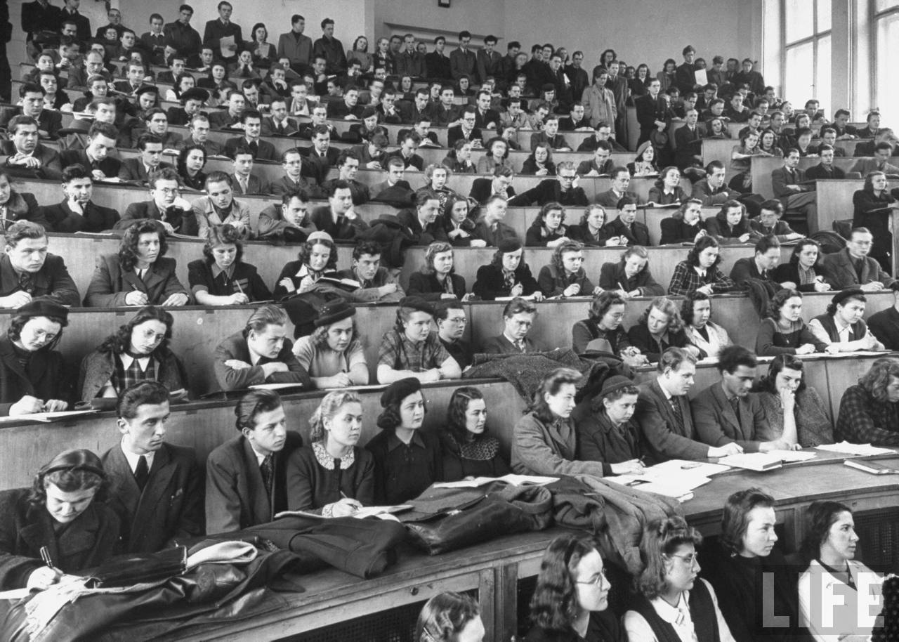 First year medical students at Charles University listening to lecture in grand amphitheater of the Biology Institute.