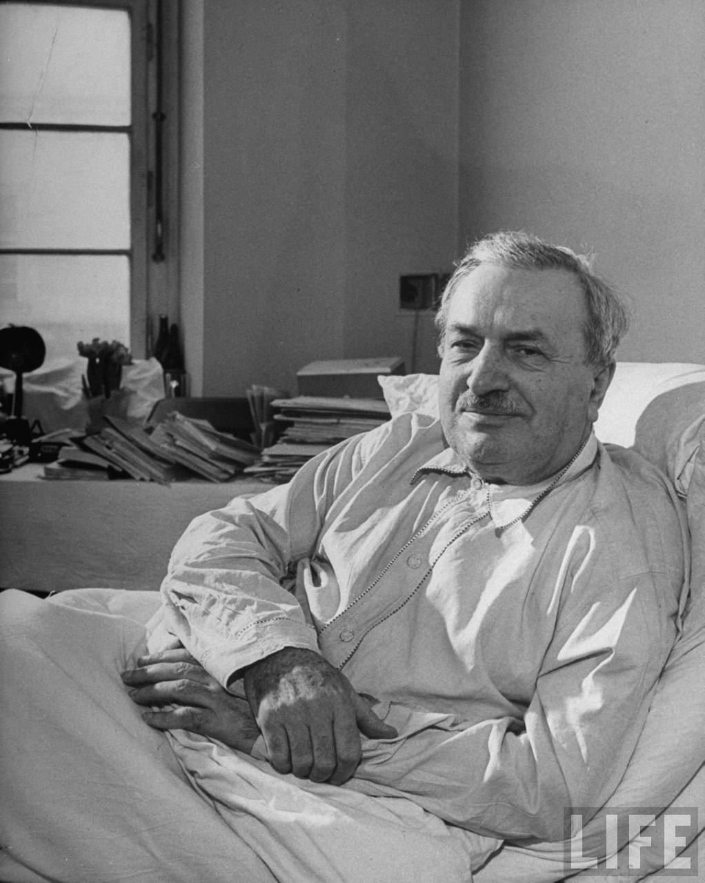 Dr. Albert Prazak, Charles University professor of Czech Literature, in hospital bed where he is recuperating from a stroke. Prazak was leader of the underground during the German occupation and of the armed revolution which freed Prague in May 1945.