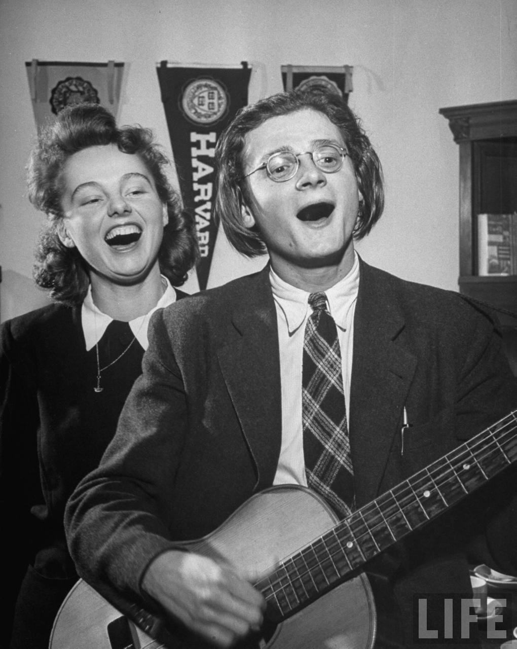 Charles University students Jirina Wurflova and Karel Vachek singing at meeting of Young Scientists club.