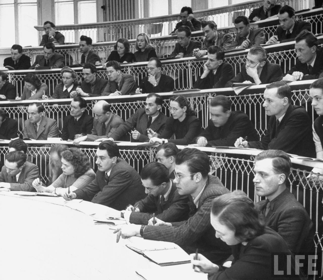 Medical students at Charles University taking notes during lecture in amphitheater of the Clinic of Surgery.