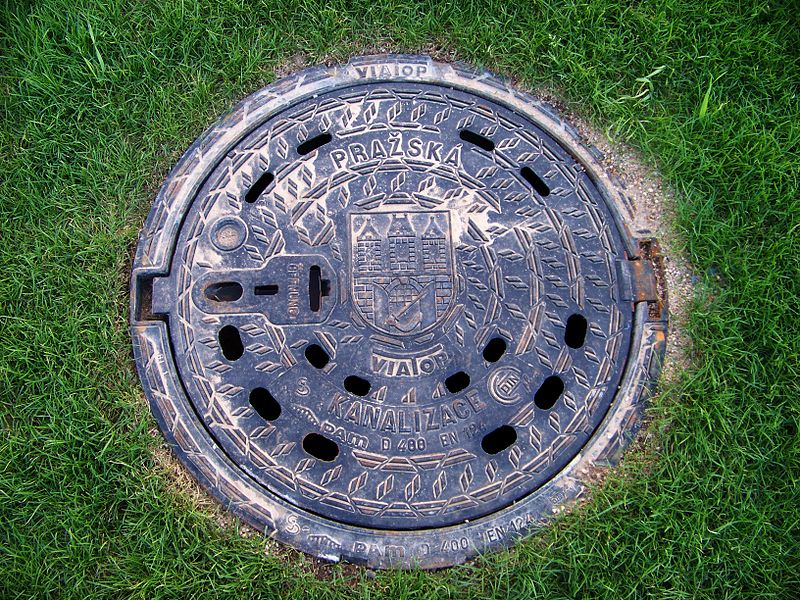 Source: ŠJu, Wikimedia Commons. Prague-Dejvice and Bubeneč, the Czech Republic. Jugoslávských partyzánů street, a canalisation cover near the former tram loop Podbaba on the new grass-covered track.