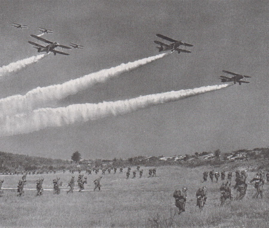 FRIENDLY CURTAINS OF SMOKE, NOT POISON GAS, FALL ON ADVANCING INFANTRY.
