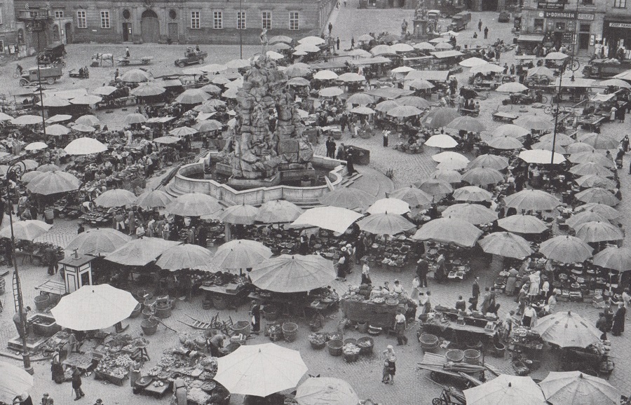 HUNGRY HUNDREDS THRONG THE KRAUT MARKET BELOW MARIA JERITZA'S WINDOW IN BRNO.